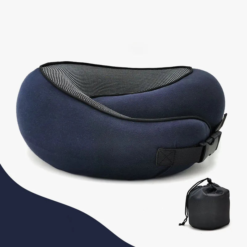 Navy blue travel neck pillow with black strap on a white background