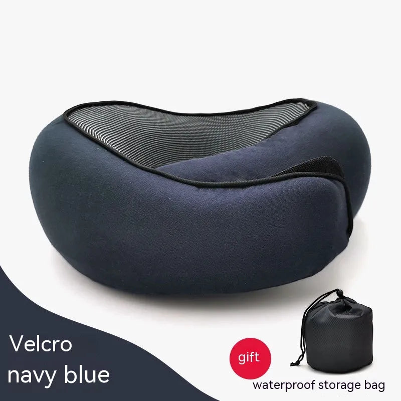 Navy blue travel pillow with a waterproof storage bag on a white background