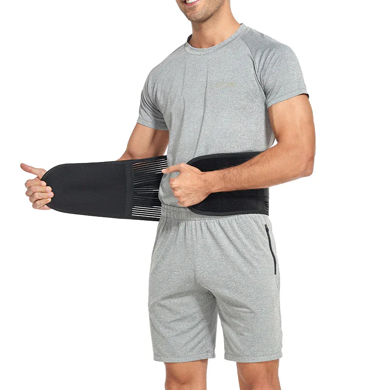 Person wearing a black back brace on a white background