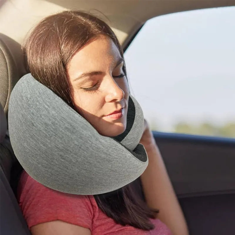 Woman using a travel neck pillow in a car