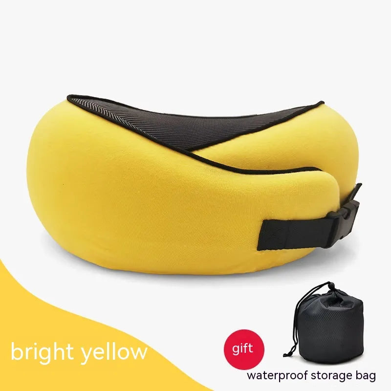 Yellow travel pillow with black straps on a white background