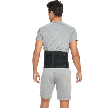 Person wearing a black waist support belt on a white background