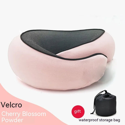 Pink neck pillow with black mesh cover and waterproof storage bag on a white background