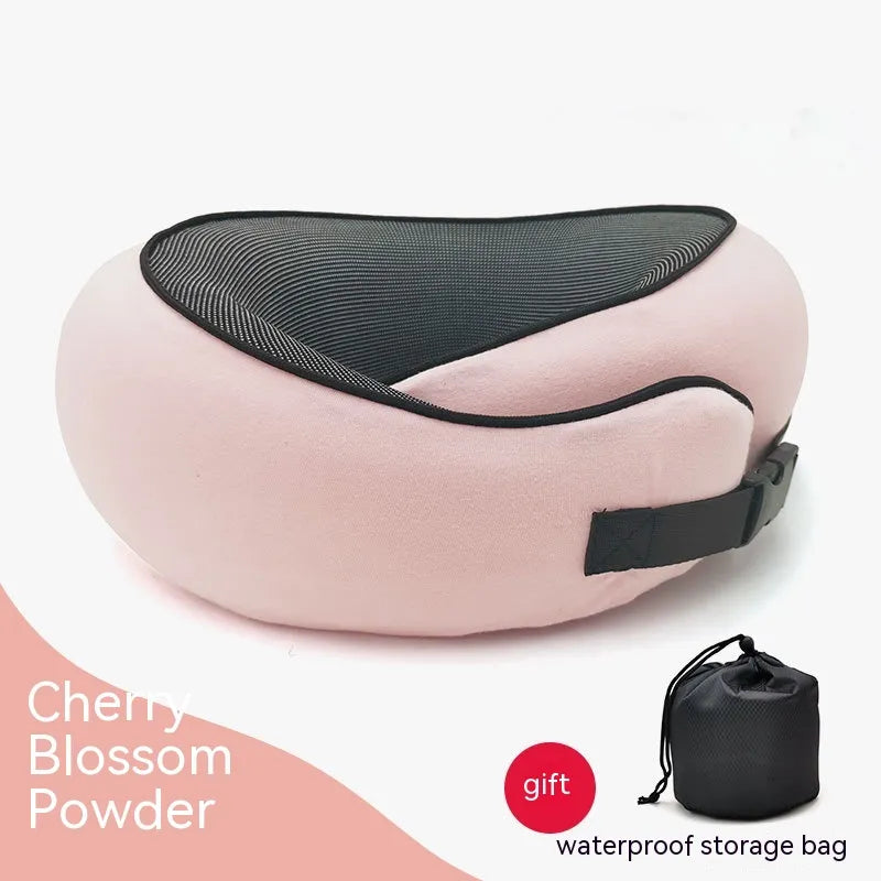 Pink travel pillow with black mesh and waterproof storage bag on a white background