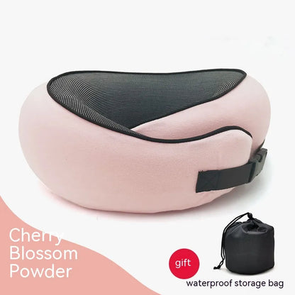 Pink travel pillow with black mesh and waterproof storage bag on a white background