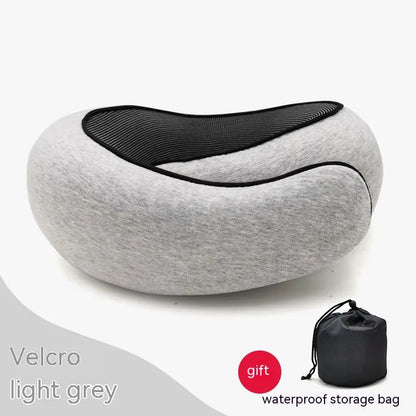 Gray neck pillow with black interior on a white background, accompanied by a waterproof storage bag.