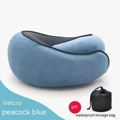 Blue travel pillow with a black storage bag on a white background