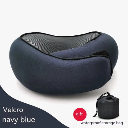 Navy blue travel pillow with a waterproof storage bag on a white background