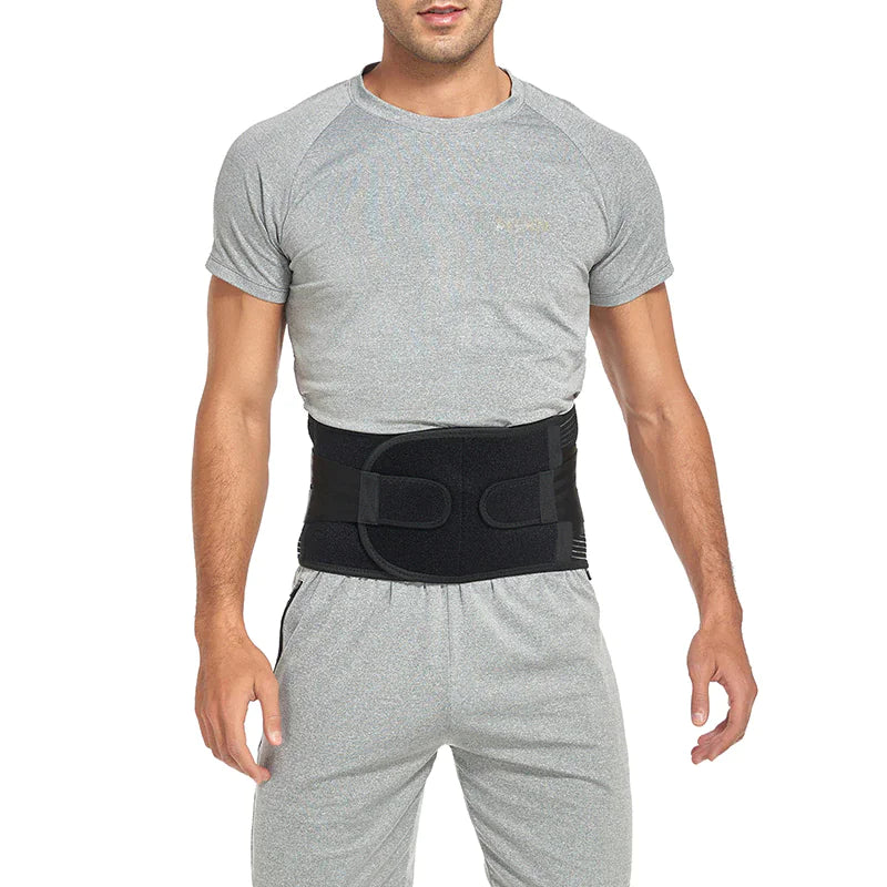Man wearing a black waist support belt on a white background